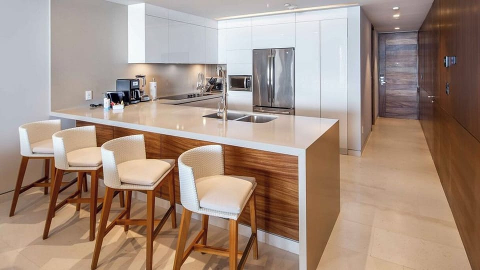 Full-size refrigerator, cooktop, dishwasher, microwave, Nespresso coffee machine