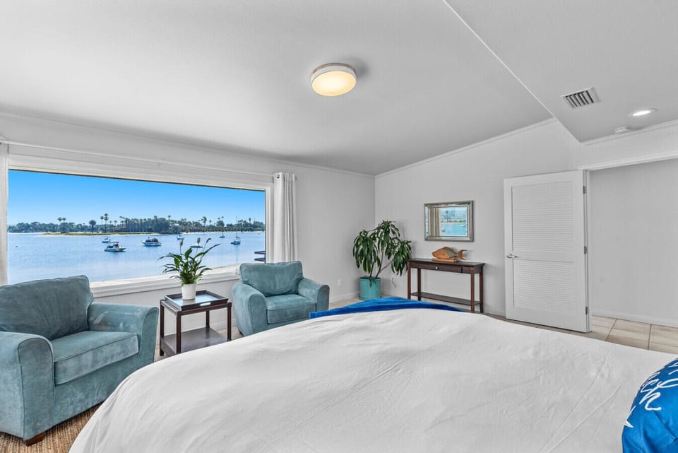 Wake up to stunning Mission Bay views from the spacious primary bedroom.
