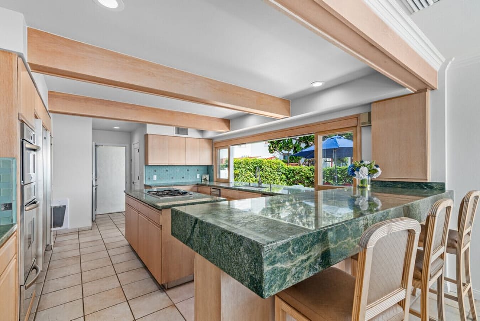 Gather around the oversized island and enjoy stunning water views while cooking and entertaining.
