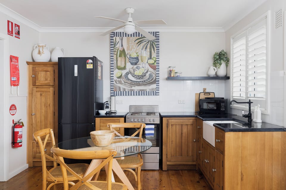 Bright country-style kitchen with dining nook and plenty of natural light