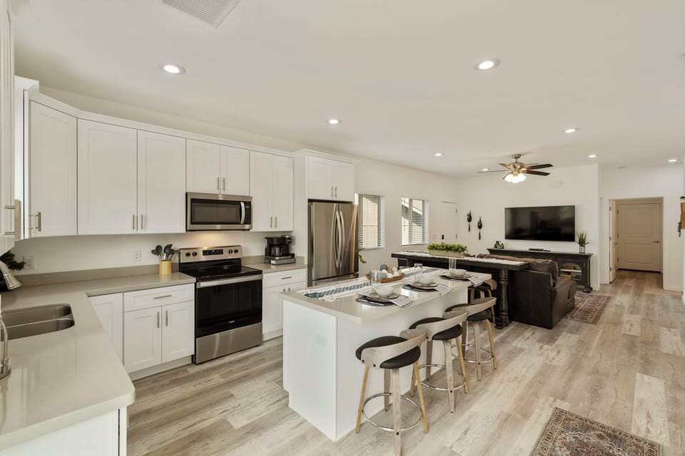 Open concept kitchen & living area with plenty of space to cook, dine and relax.