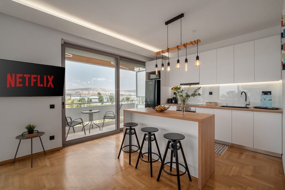 Open-plan kitchen with island and panoramic views