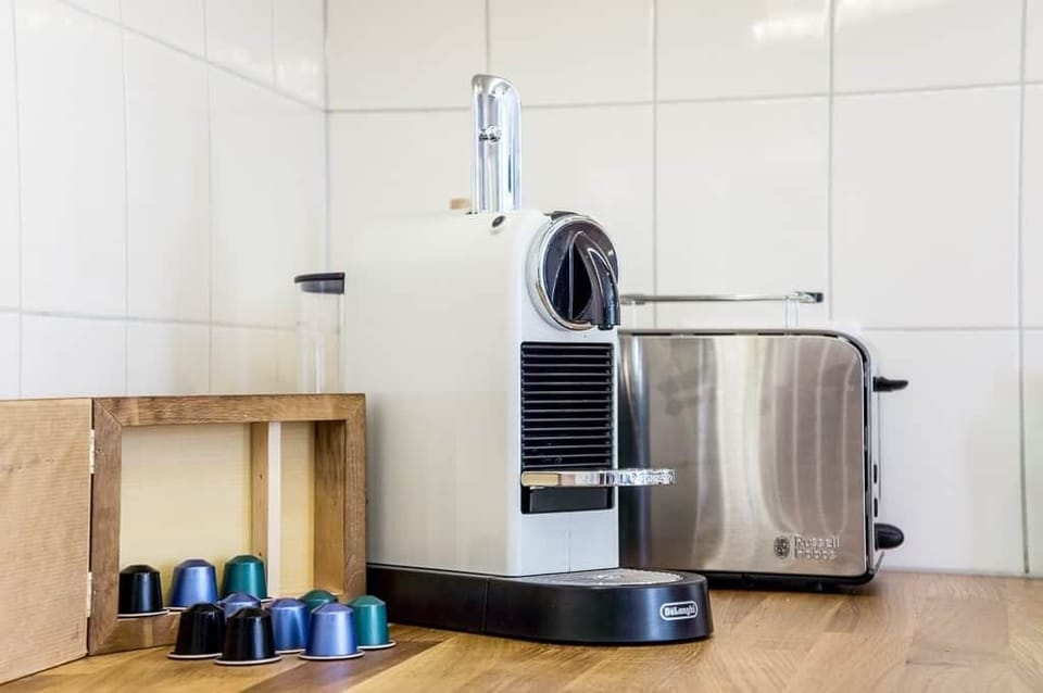 Nespresso coffee machine with milk foamer. Cups provided