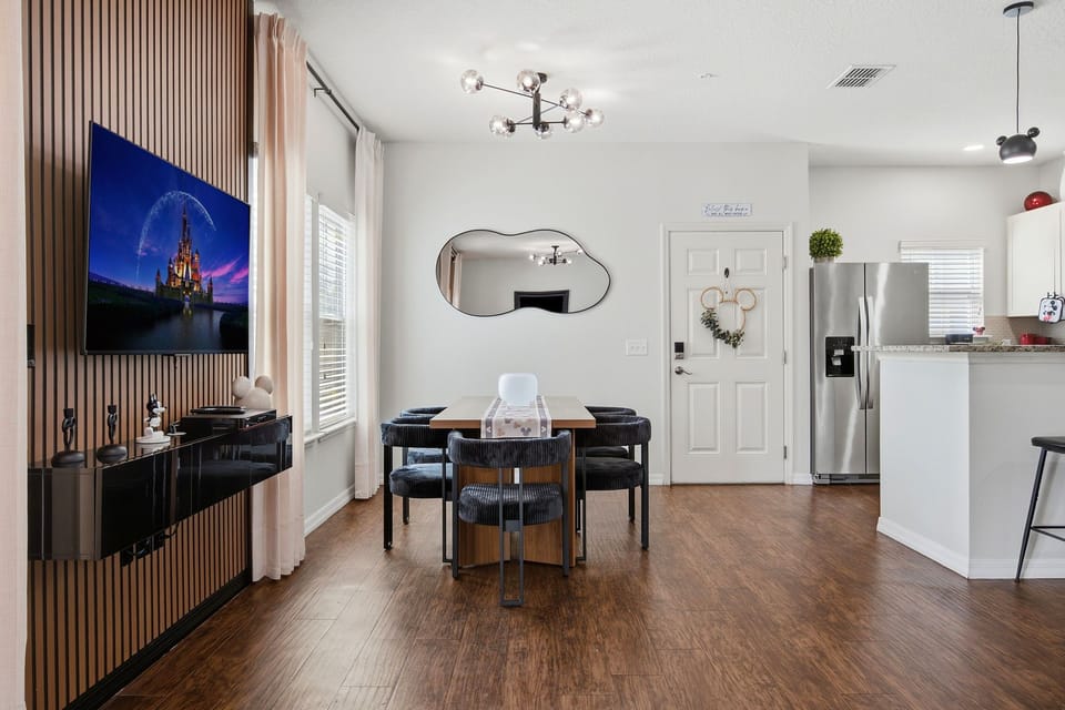Bright modern dining space with designer accents and seamless kitchen flow