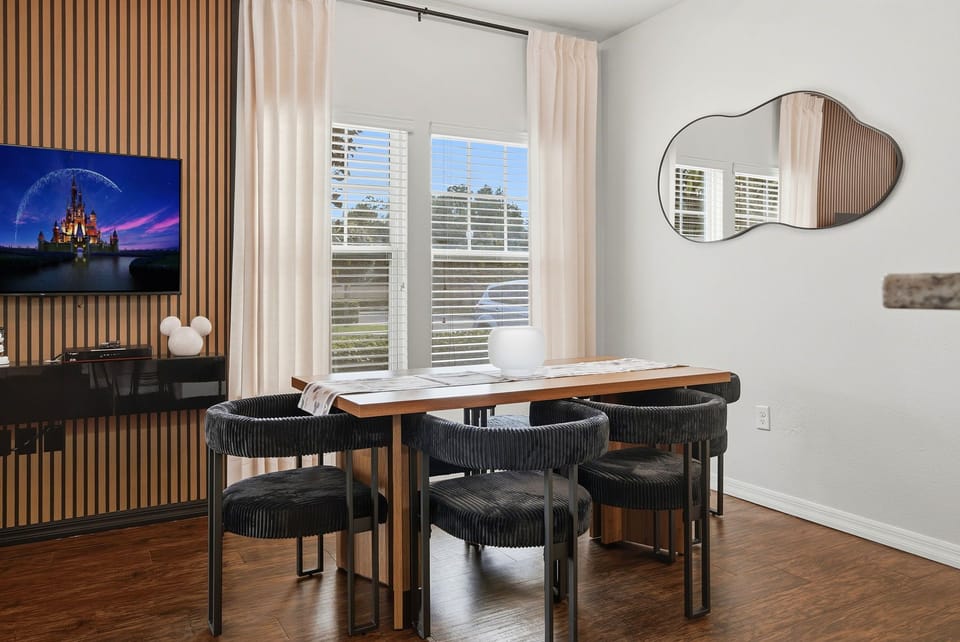 Bright modern dining nook with stylish seating and natural light