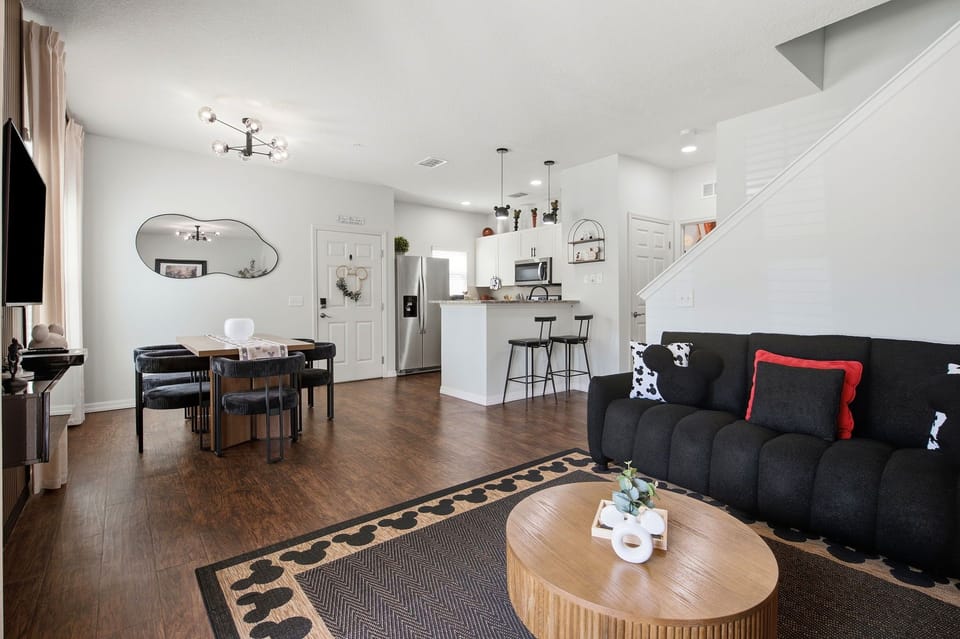 Bright open-concept living space with modern kitchen and stylish seating