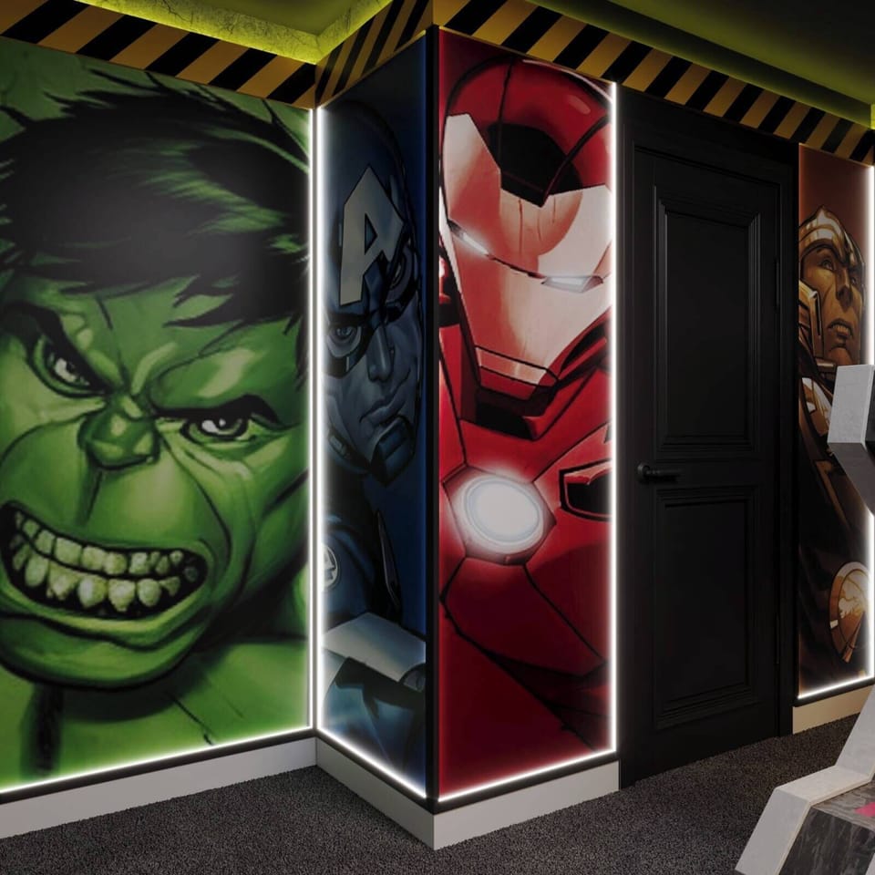 Immerse yourself in a vibrant space adorned with superhero murals that energize the atmosphere. The lively colors and creative art spark your inner hero, while stylish lighting adds to the fun for an unforgettable experience for.