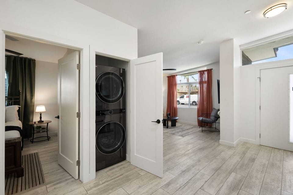 Modern comfort meets everyday convenience with a bright living space, seamless room flow, and a dedicated washer and dryer area.