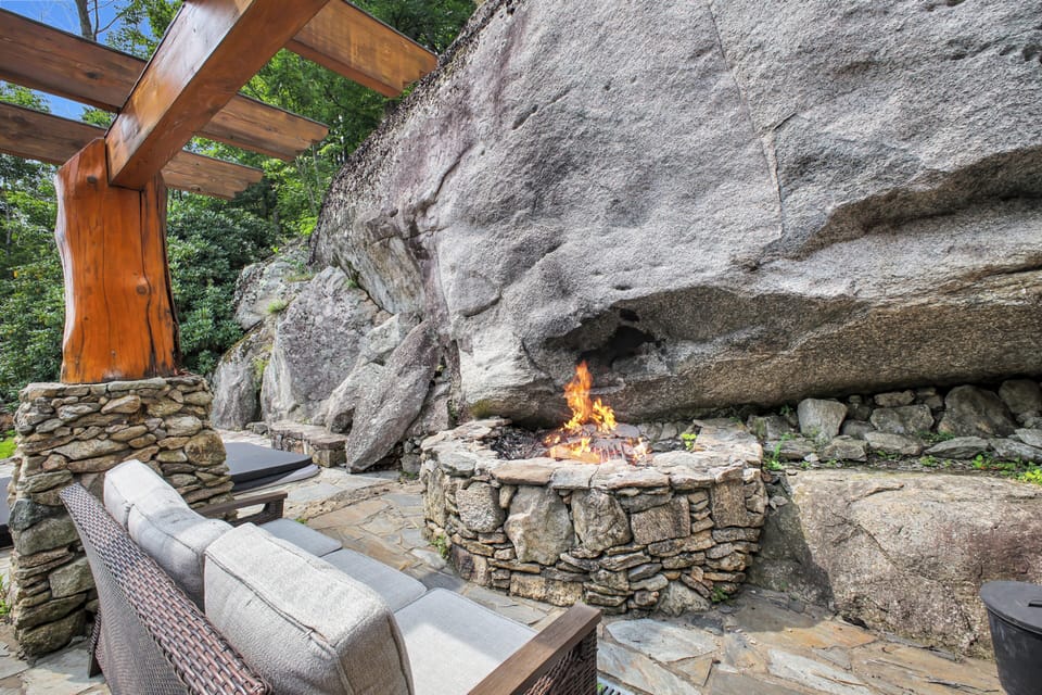 Pull a chair up to the wood-burning stone fire pit, built right into the base of the cliff for late nights under the stars.