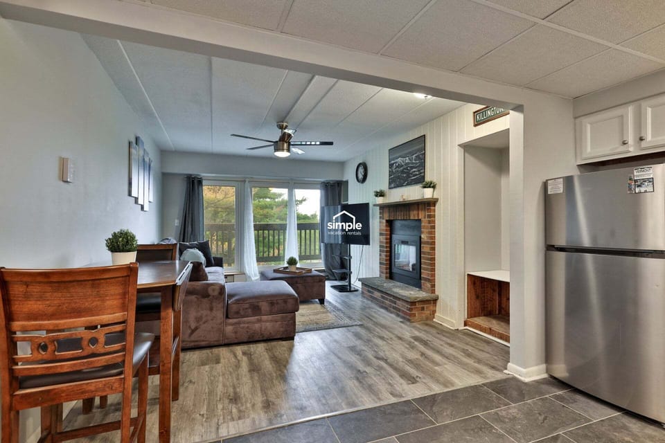The fireplace and balcony come into view as soon as you step through the door.
