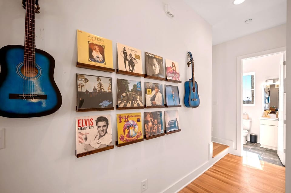 Music-inspired artwork and vintage records line the hallway, adding another touch of Nashville personality throughout your stay.