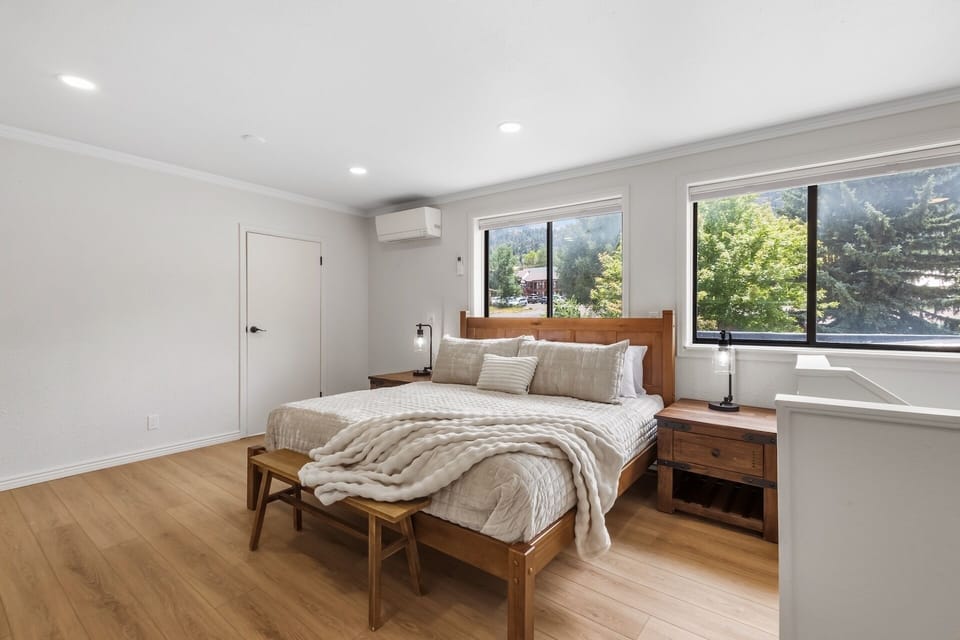 Primary ensuite bedroom with one king bed and private full bathroom – located on upper level (3rd floor).