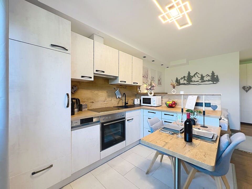 Kitchen, Countertop, Interior Design, Kitchen Appliance, Furniture, Flooring, Cabinetry, Wood, Ceiling, Major Appliance