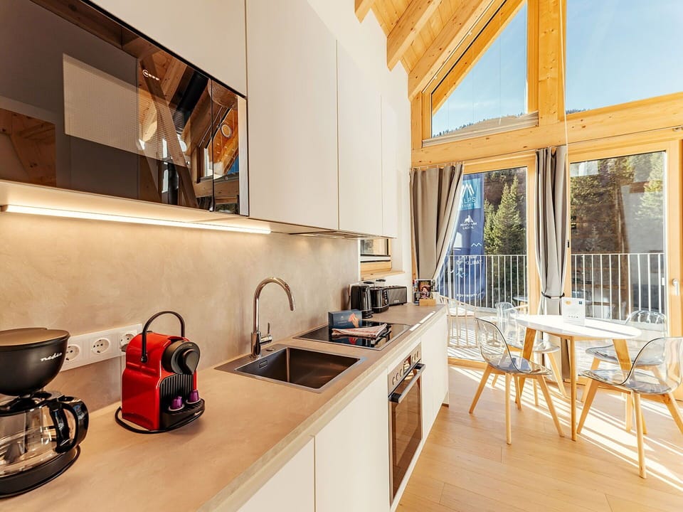 Kitchen, Interior Design, Wood, Furniture, Countertop, Flooring, Ceiling, Kitchen Appliance, Lighting, Floor
