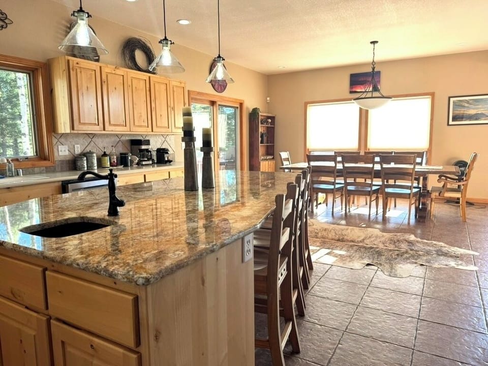 Seating for twelve at the dining room table and counter nook.