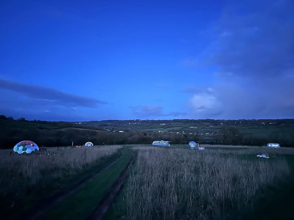Blue hour calm settles over the domes and rolling hills