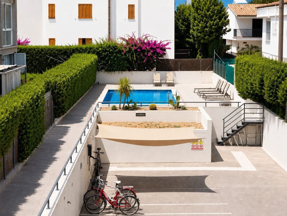 Shared swimming pool with sun terrace, loungers and landscaped gardens, providing the perfect place to relax and enjoy the Mediterranean sunshine.