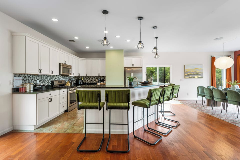 Bright open kitchen with large island seating and stylish dining space