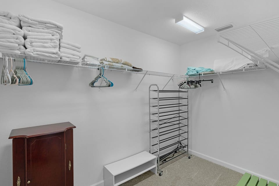 Your own spacious walk-in closet with generous shelving, hanging space, and thoughtful organization to keep everything in its place during your stay.