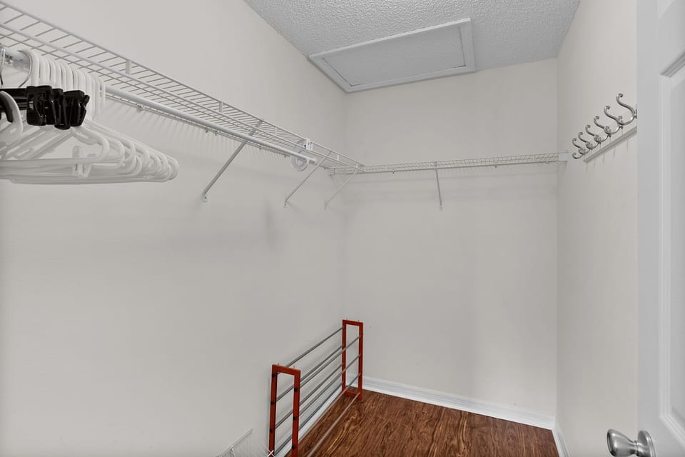 Your walk-in closet offers ample hanging space and a convenient shoe rack, giving you plenty of room to organize and settle in.