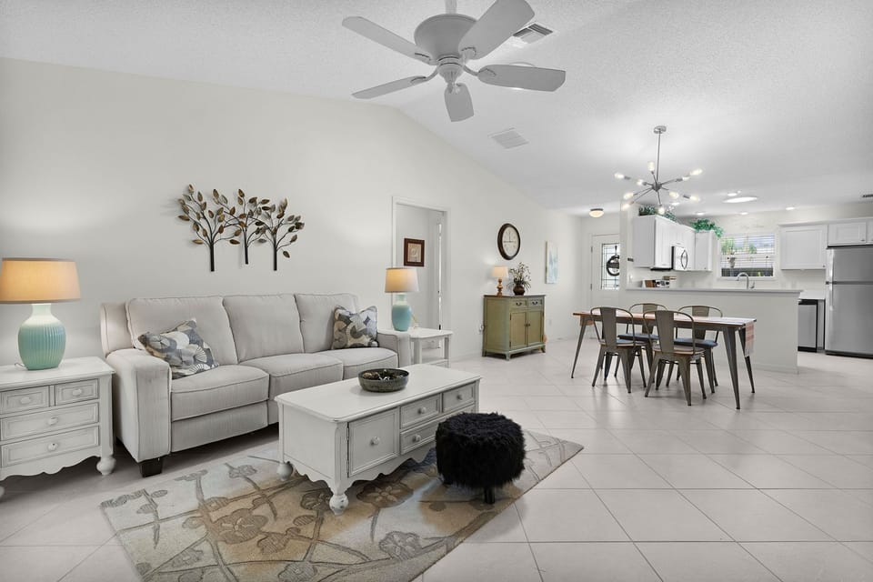 Settle into your bright, open-plan living space where comfort meets modern design. The welcoming living area flows seamlessly into the dining room and fully-equipped kitchen—perfect for relaxing after a day of adventures or gathering with loved ones.