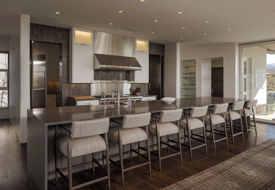 Gather around this stunning kitchen island where culinary magic happens. Sleek countertops and professional appliances make cooking a joy.