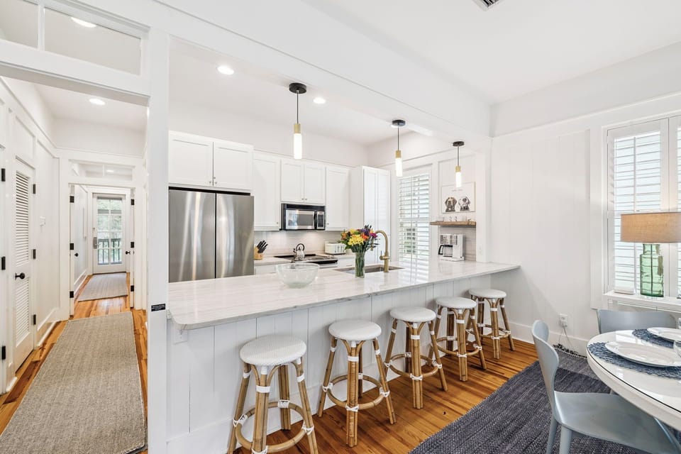 Your bright, modern kitchen awaits with marble countertops, stainless appliances, and a spacious island perfect for morning coffee or evening conversations.