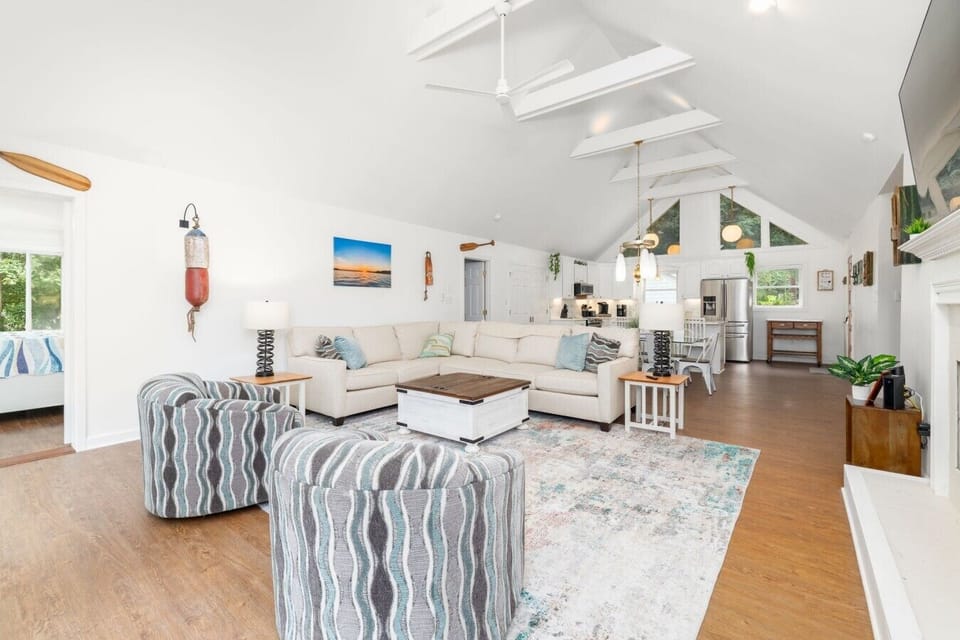 Spacious open-concept living room with panoramic lake views.