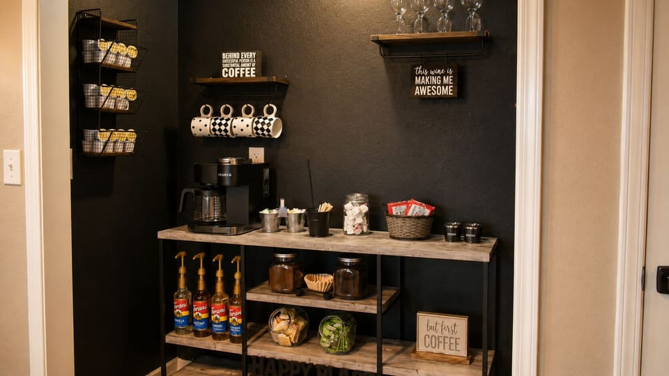 Chic self-serve coffee bar with syrups, mugs, and boutique-style charm