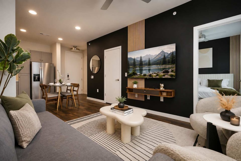Spacious open living room with Smart TV and modern designer touches.