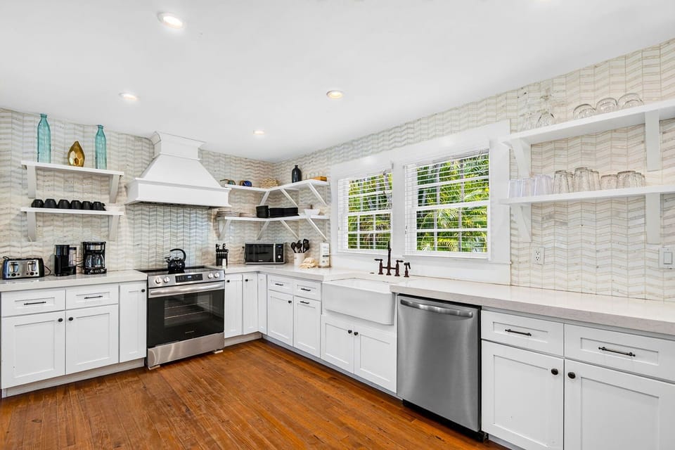 Bright farmhouse kitchen with stainless appliances and large sink