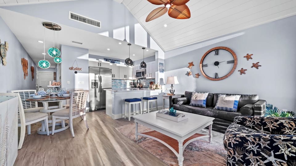 Bright coastal living with vaulted ceilings, open kitchen, and stylish lounge