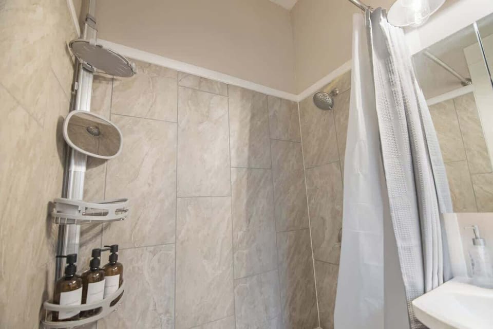 Updated with a fully tiled shower and tub.