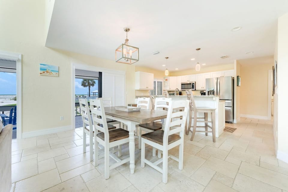 The dining area opens onto the kitchen for easy meals.