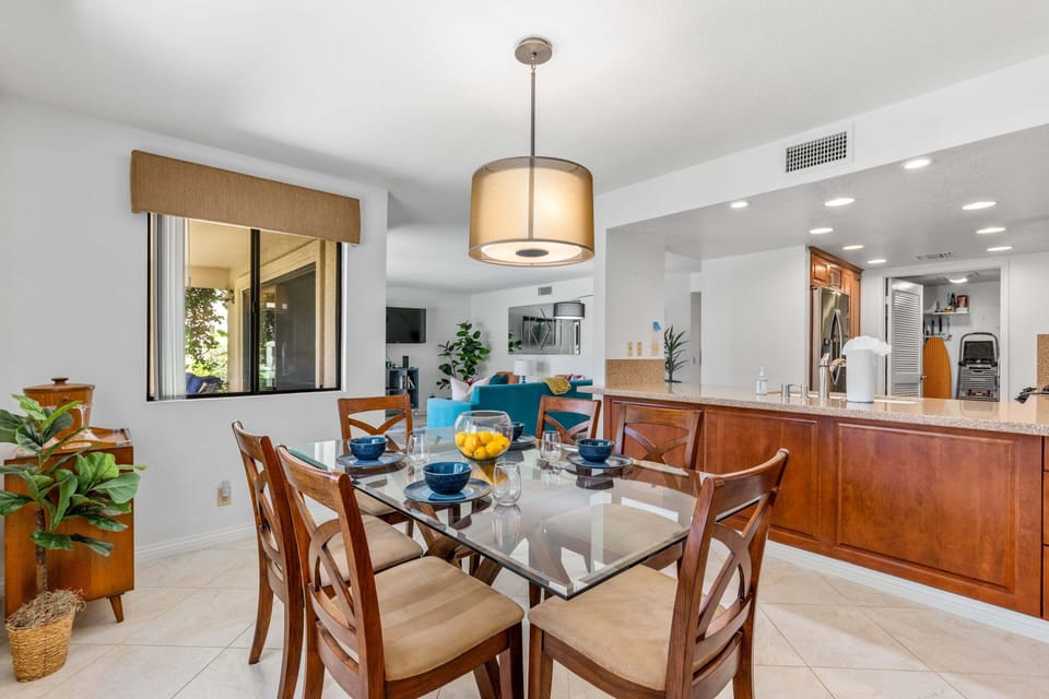 Dining space with a table and chairs for 6 guests.