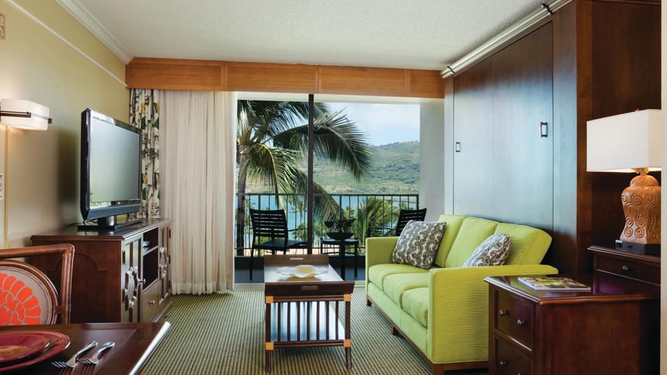 Cozy tropical suite with private balcony and stunning water views