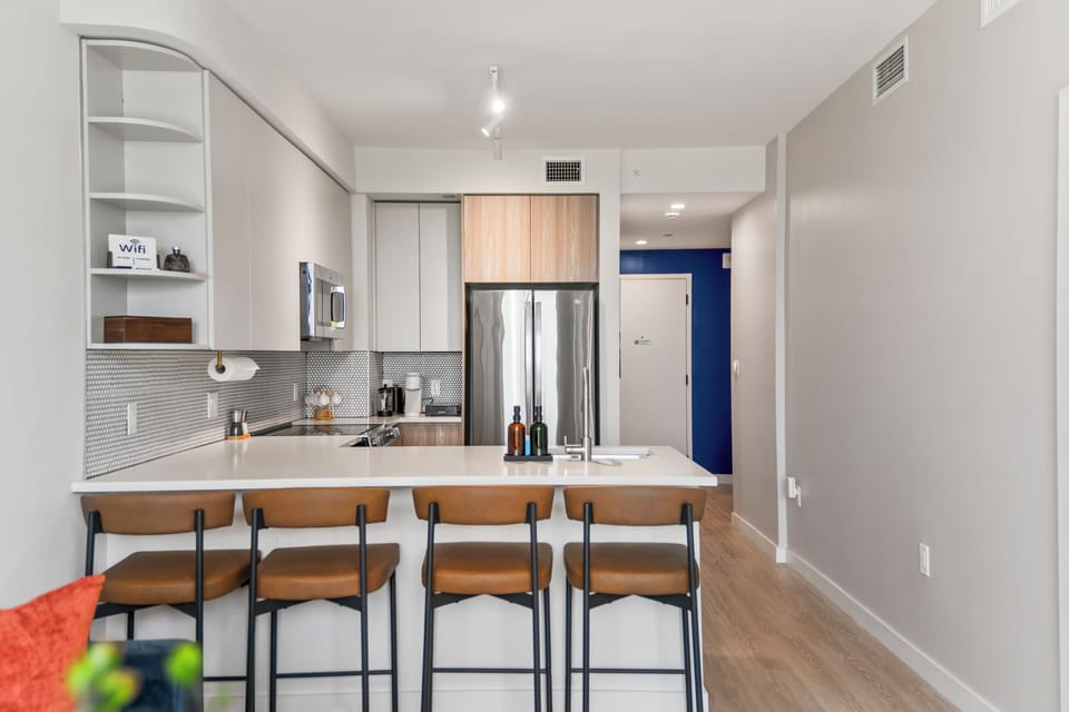 Modern kitchen with breakfast bar seating for 4 and sleek finishes