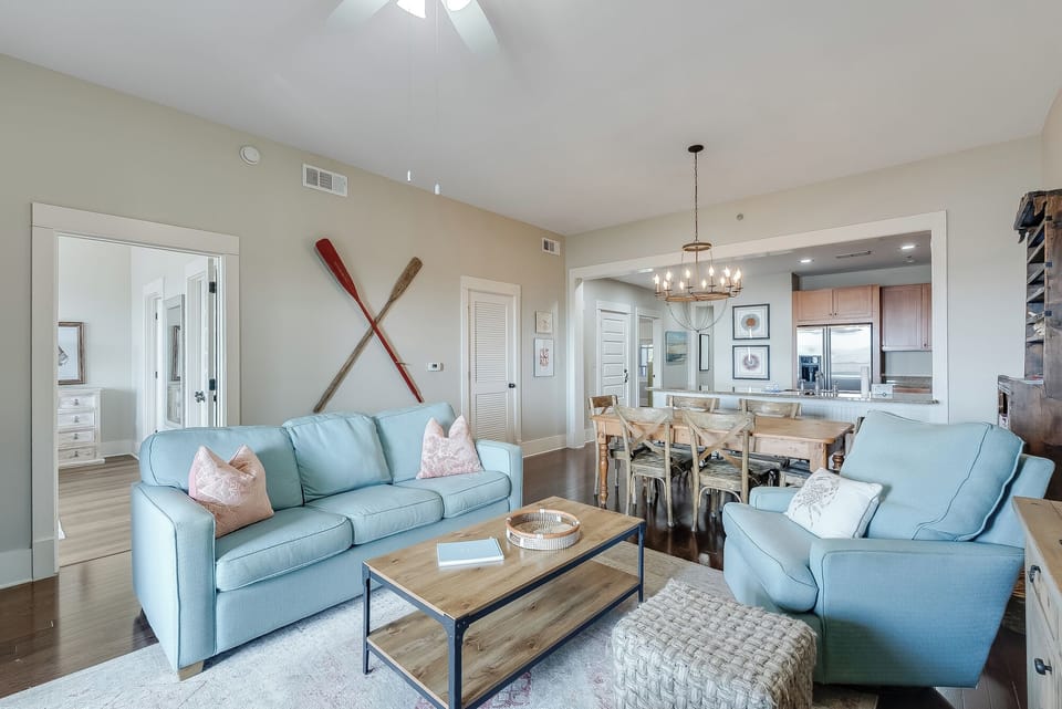 Bright open living space with dining area and stylish coastal touches