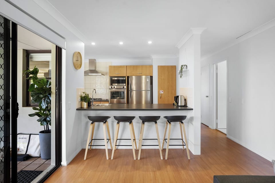 Kitchen with breakfast bar and seating for four