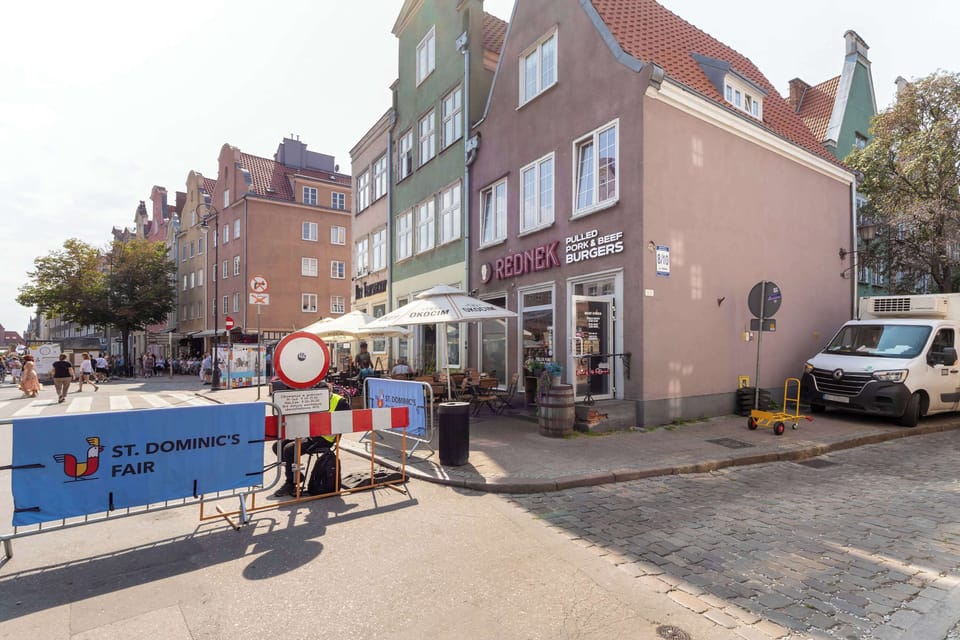 A view of the apartment building and the surrounding neighborhood. Nearby streets and local amenities are within easy walking distance.