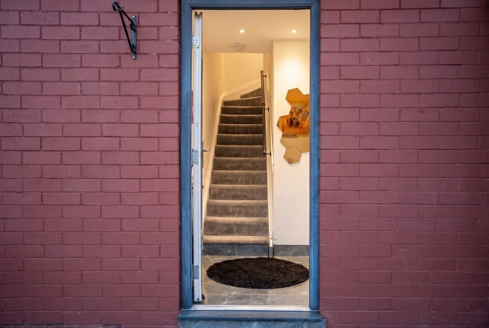 Welcoming private entrance leading up to your stylish retreat
