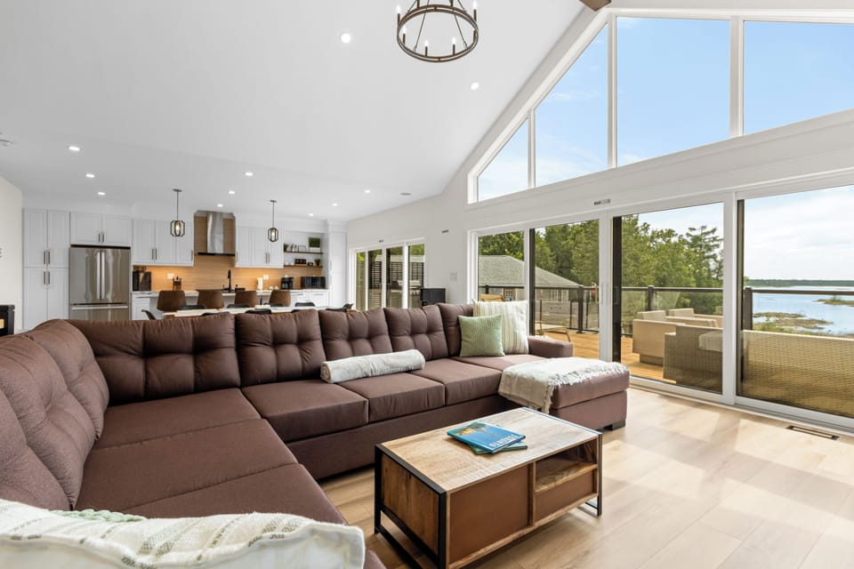 Unwind in the spacious living room with comfortable seating and easy access to the deck.