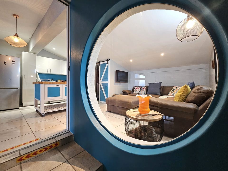 A view of the kitchen and living room from the staircase