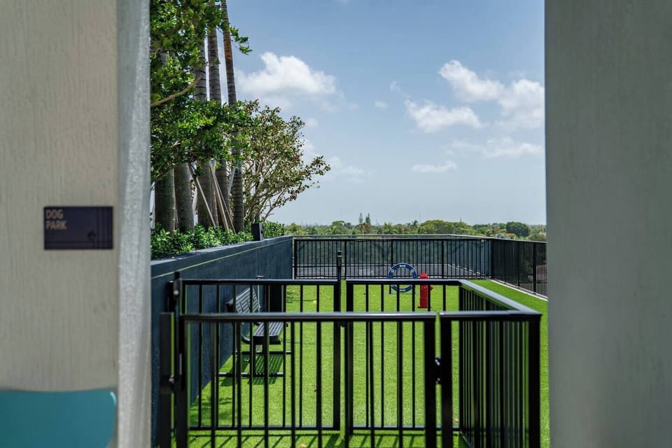 Private fenced dog park with turf—perfect for pet-friendly stays