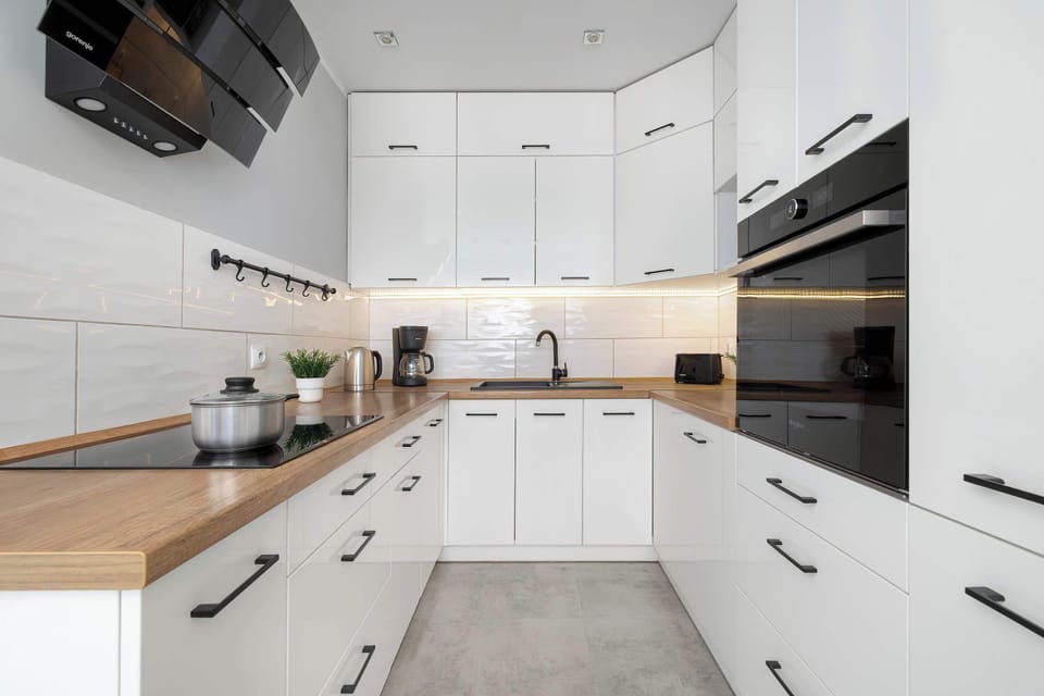 A fully equipped kitchen with modern appliances and plenty of counter space. Everything you need to prepare home cooked meals is within easy reach.