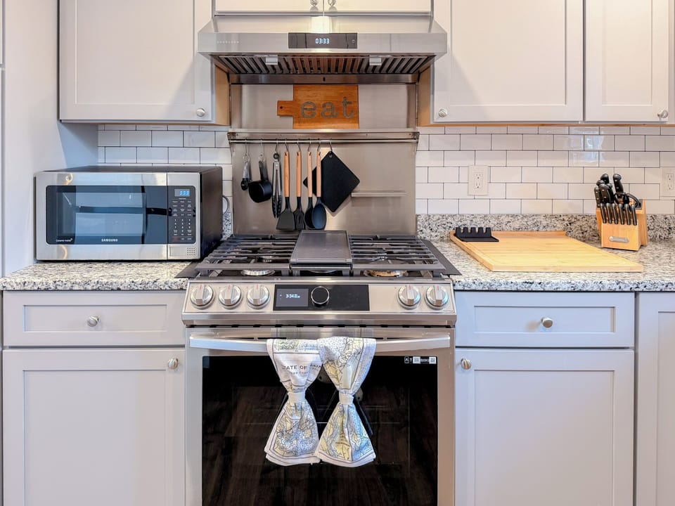 Premium gas range and stainless-steel appliances for home-cooked meals.