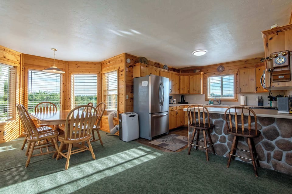 Sunlit country kitchen with all the counter space you need — because vacation cooking should feel like an upgrade, not a chore.
