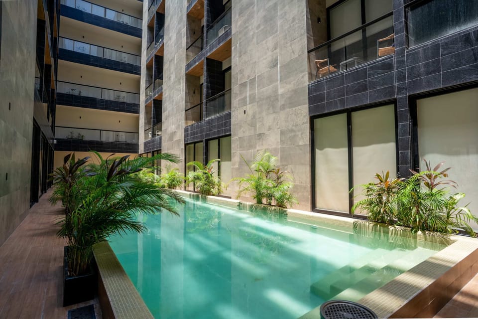 Resort-style indoor pool with tropical gardens