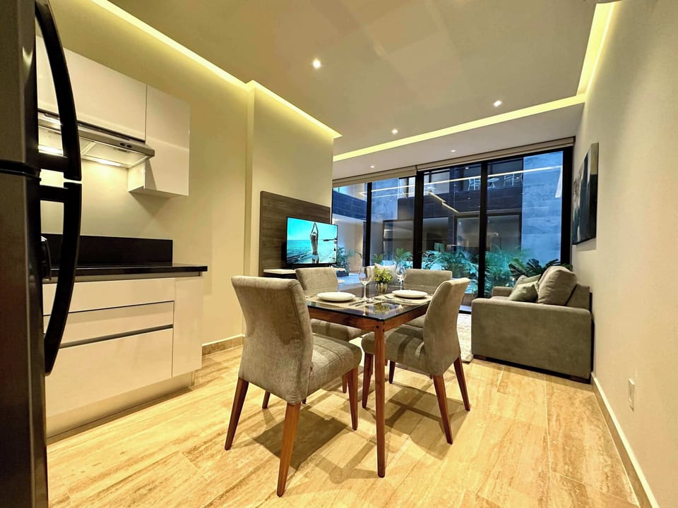 Kitchen and dining area open to living room