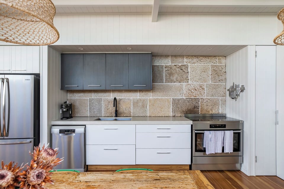 Prepare everything from a beach picnic to a family dinner in the kitchen, where modern appliances and essentials make cooking a pleasure.